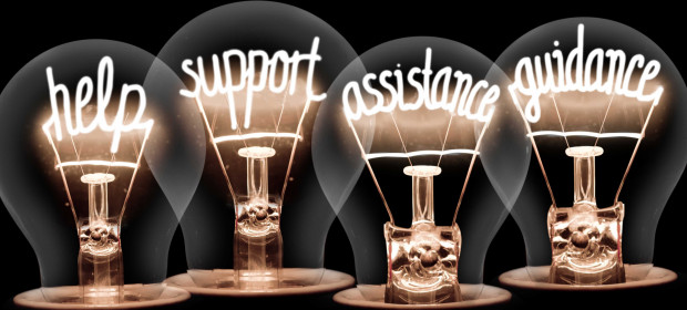 Four lightbulbs that each have a word within the bulb wire. Help, support, assistance, guidance 