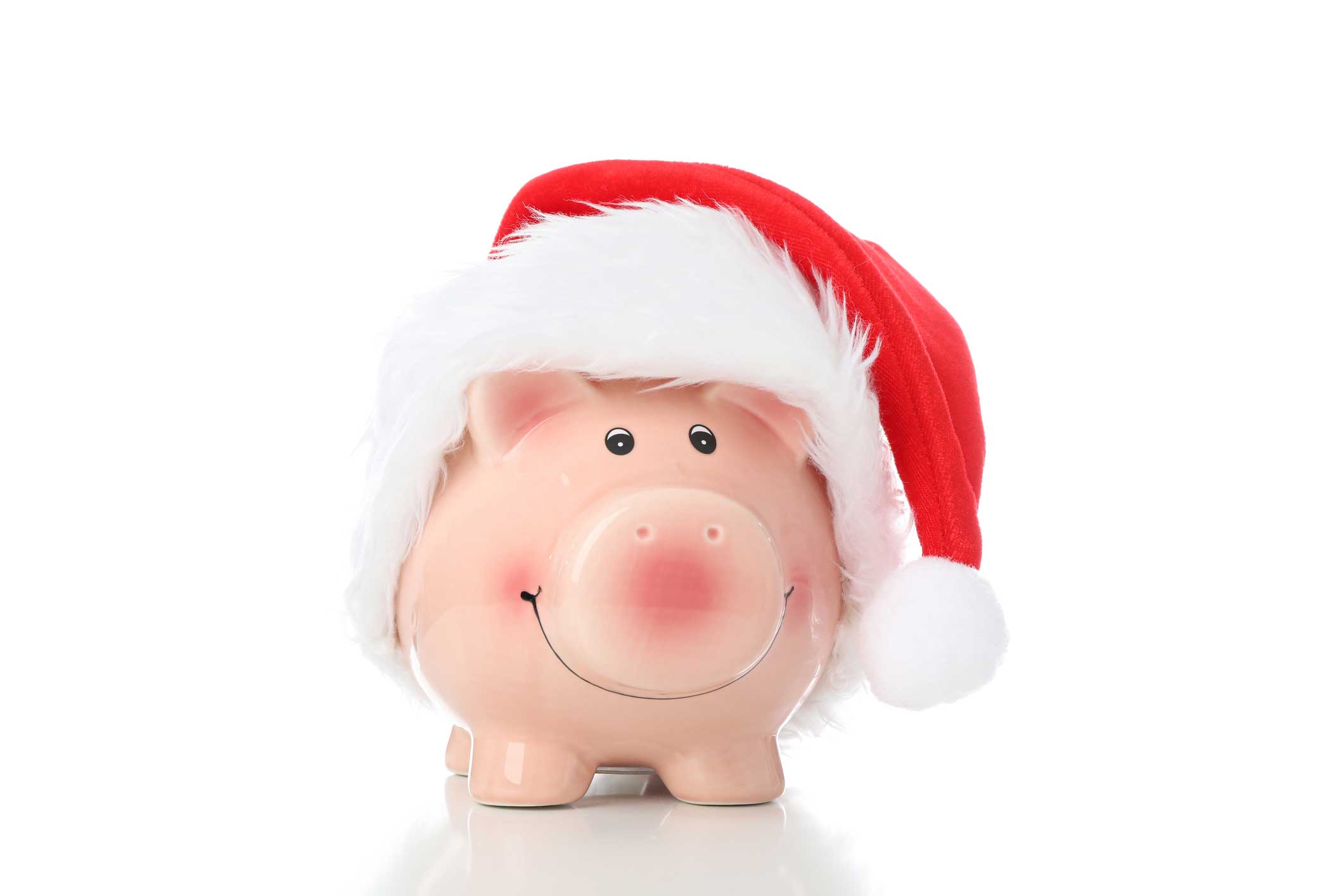 A piggy bank with a santa hat on 