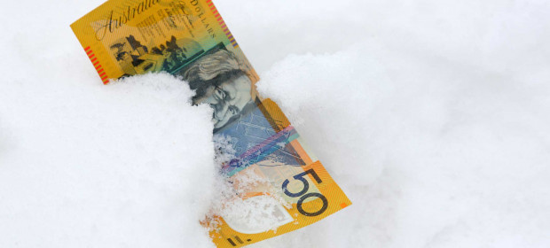 A fifty dollar note lying in snow
