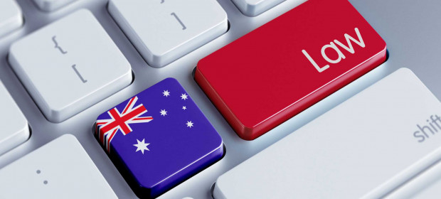 Laptop keyboard, one key painted as the Australian flag and another key red that says Law